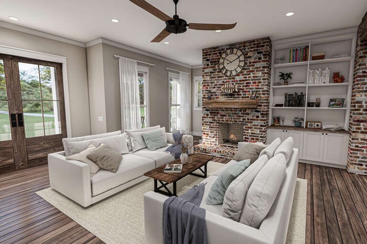 Modern living room with brick fireplace and elegant decor.