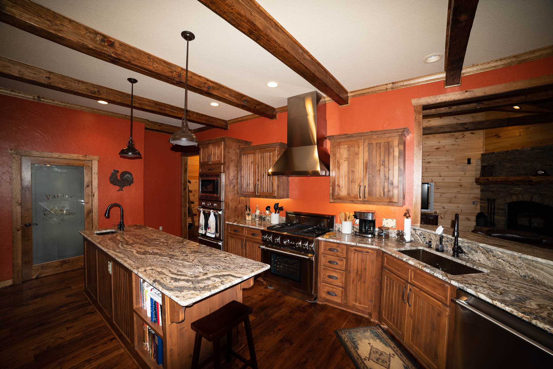 Rustic kitchen with wooden cabinets and granite countertops.