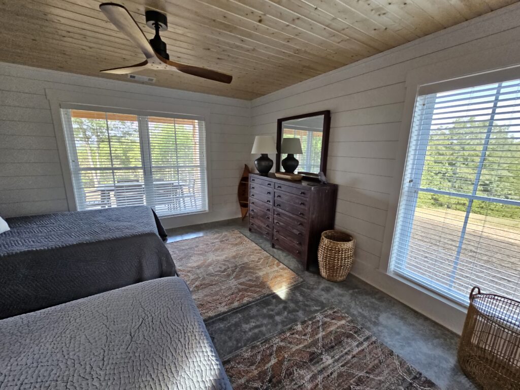 Cozy bedroom interior with natural light and stylish decor.