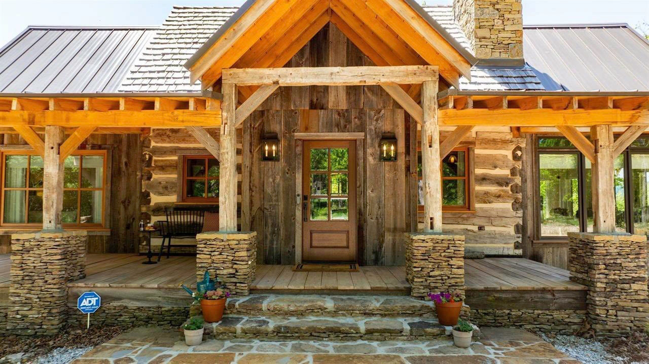Front porch and stone entry of the historic log cabin in Timbo, Arkansas