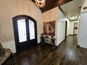 Foyer with arched iron doors